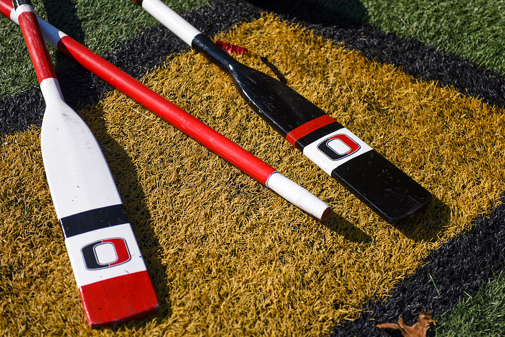 Odessa oars sit on the sidelines by the benches.